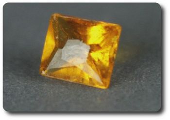 0.17CT. ORANGE CLINOHUMITE. VS