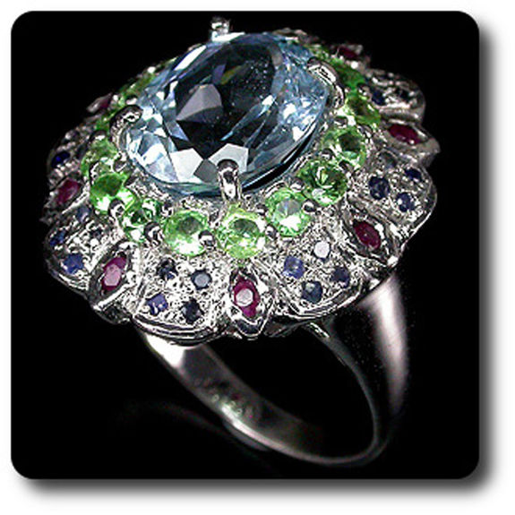 TOPAZ, TSAVORITE GARNET, SAPPHIRE & RUBY RING
