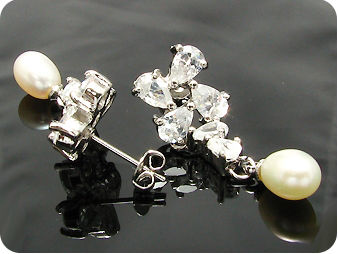 Exotic 2x9mm White Fresh Water Pearl Oval Cut Earrings