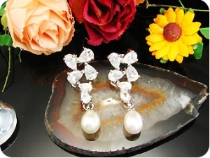 Exotic 2x9mm White Fresh Water Pearl Oval Cut Earrings