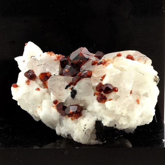 Spessartine Garnet, Orthoclase, Quartz, Tourmaline.
