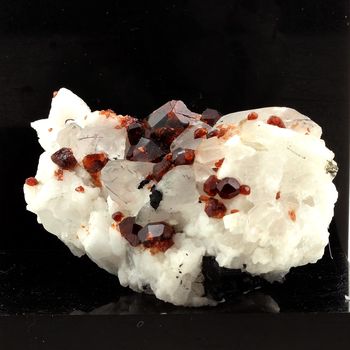 Spessartine Garnet, Orthoclase, Quartz, Tourmaline.