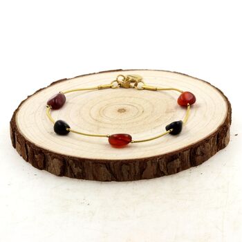 Bracelet en acier doré inoxydable 5 Perles Agate rouge + Obsidienne noire.