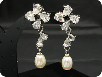Exotic 2x9mm White Fresh Water Pearl Oval Cut Earrings