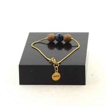 Bracelet en acier doré inoxydable 1 Perle Oeil de Tigre bleu clair + bois 8 mm.