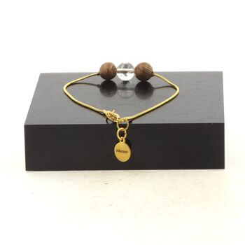 Golden stainless steel bracelet 1 Quartz from Brazil + wood 8 mm Bead.