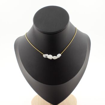 Howlite from the USA 4 beads necklace. Golden Stainless steel chain