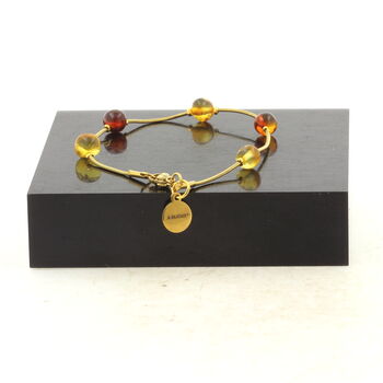 Golden Stainless steel bracelet 5 Genuine Baltic Sea Amber Beads 5mm-6mm.