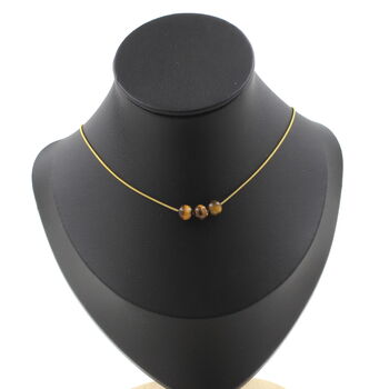 Collier 3 perles Oeil de Tigre 6 mm. Chaine en acier doré inoxydable