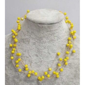 multi-strand pearl jewelry in yellow