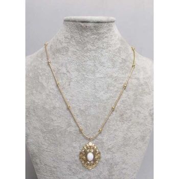 medaillon cristal pierre acier dore