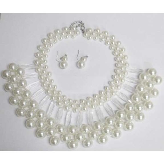 Exaggerated jewelry in spherical pearls