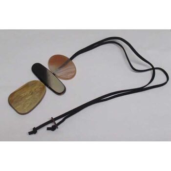 Brown plaque jewelry on suede