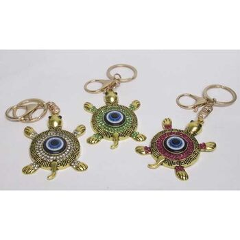 bijoux porte clé tortue oeil en doré