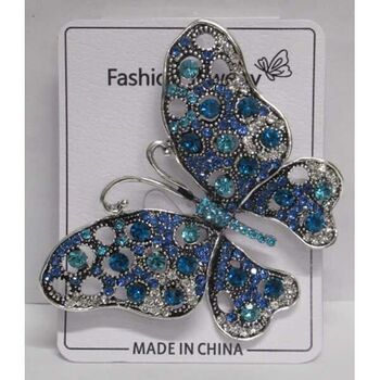 Blue butterfly brooch jewelry in flight