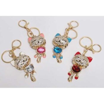 Gold cat bag charm with fancy colored crystal