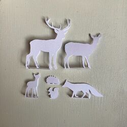 Set of animals made in white paper