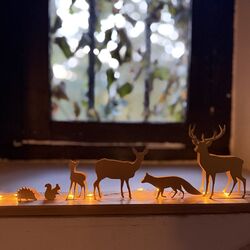 white animals scene with a led garland for customization