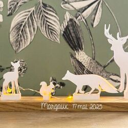 white animals scene with a led garland for customization