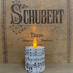 Led candle with moving flame - paper sheet music - H 7,5 CM