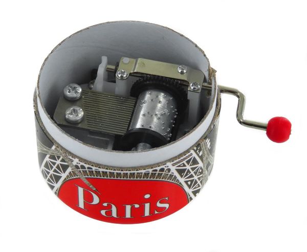 Boîte à musique à manivelle dans une boîte ronde en carton avec