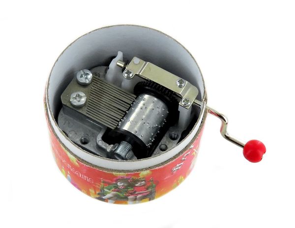 Boîte à musique à manivelle dans une boîte ronde en carton avec