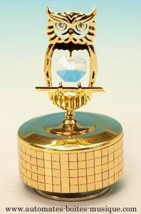 Music box made of gold colored metal and Swarovski crystal with traditional 18-note musical mechanism - Item # for this Swarovski crystal music box: 12313-3.