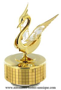 Music box made of gold colored metal and Swarovski crystal with traditional 18-note musical mechanism - Item # for this Swarovski crystal music box: 12306.