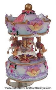 Kleines Miniaturkarussell mit Spieluhr aus Kunstharz : kleines sich drehendes Karussell.