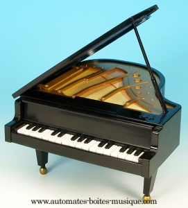 Instrumento de música em miniatura: caixa de música em forma de piano de cauda em resina.