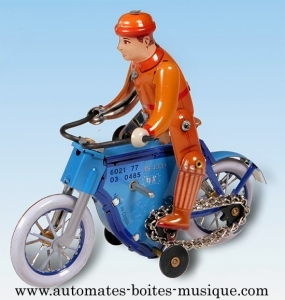 Brinquedo mecânico de colecção em metal, latão e ferro branco grafado: brinquedo mecânico mota azul.