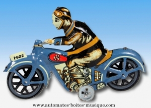 Mechanisches Sammlerspielzeug aus gefalztem Metall, Blech und Weißblech : mechanisches Spielzeug Motorradfahrer 1950.