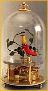 Mechanical singing birds automatons in a transparent cage made of plexiglass for showing the complex mechanism of the singing bird automatons (golden finish) - Item# for these mechanical singing birds automatons : OC-102