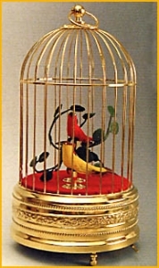 Mechanical singing birds automatons in a golden cage made of metal - Item# for these mechanical singing birds automatons : OC-104