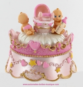 Musical new-born automaton babies in a pink carousel.