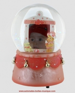Musical snow globe with a baby girl.