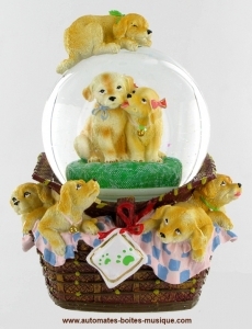 Musical snow globe made of polystone : snow globe with dogs in a basket.