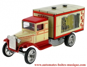 Giocattolo meccanico da collezione di metallo, lamiera e latta aggraffati : giocattolo "Camion del circo".
