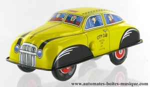 Collectable mechanical tin toy : friction yellow car made of sheet metal and tin.