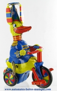 Collectable mechanical tin toy : Duck on a tricycle made of sheet metal and tin.