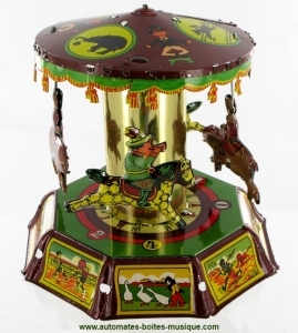 Collectable mechanical tin toy : Country carousel made of sheet metal and tin.