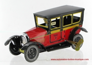Mechanisches Sammlerspielzeug aus gefalztem Metall, Blech und Weißblech : mechanisches Spielzeug "rotes Taxi".
