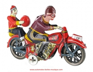 Giocattolo meccanico di metallo, lamiera e latta aggraffati : giocattolo meccanico "Motociclista con passeggero".