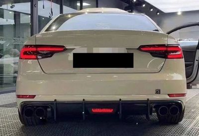 DIFFUSEUR DE PARE CHOC ARRIERE EN ABS "DTM LOOK AVEC FEU STOP" AUDI A4 B9 8W STANDARD / SLINE OU S4 PHASE 1 (08-2015/04-2019)