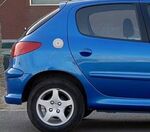 ENJOLIVEUR DE TRAPPE A ESSENCE CHROME PEUGEOT 206/207 OU CITROEN C2 (1998/2009)