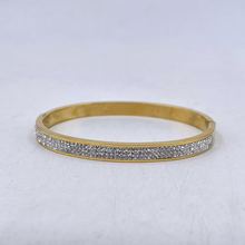 Bracelet manchette en acier inoxydable doré incrustation de cristaux