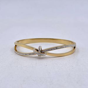 Bracelet manchette en acier inoxydable doré incrustation de cristaux