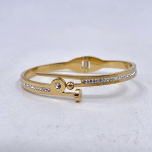 Bracelet manchette en acier inoxydable doré incrustation de cristaux