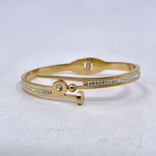 Bracelet manchette en acier inoxydable doré incrustation de cristaux