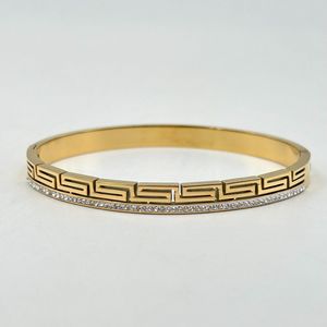 Bracelet manchette en acier inoxydable doré incrustation de cristaux